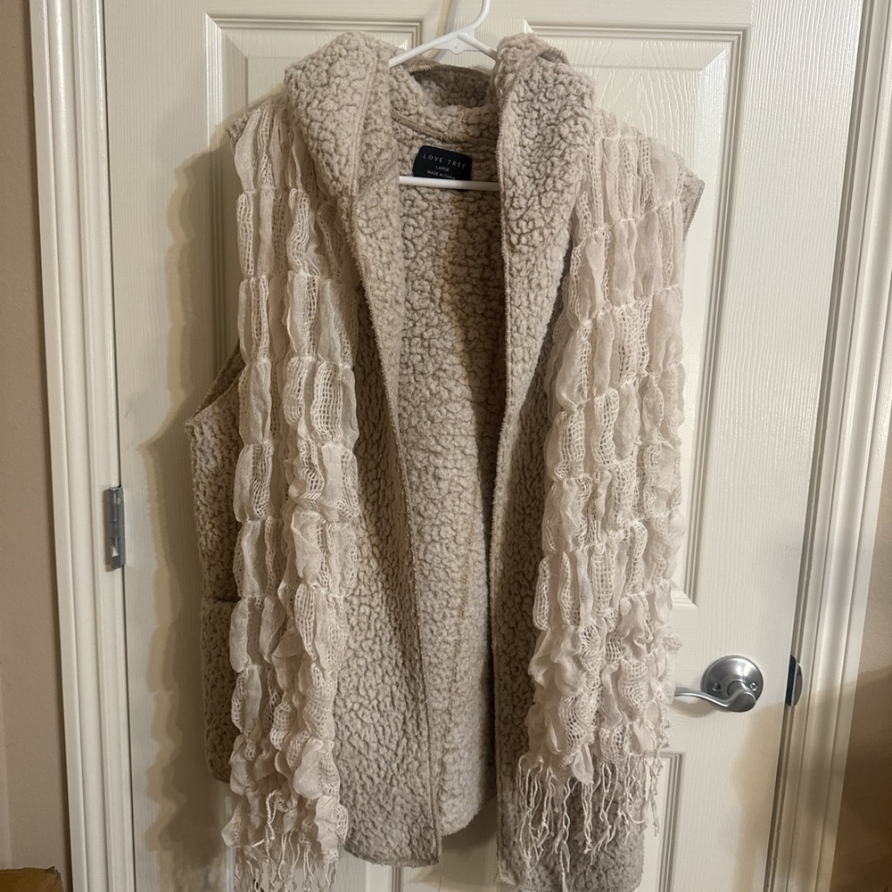 Large Cream Sherpa Vest with wavy beige scarf. Vest has pockets.